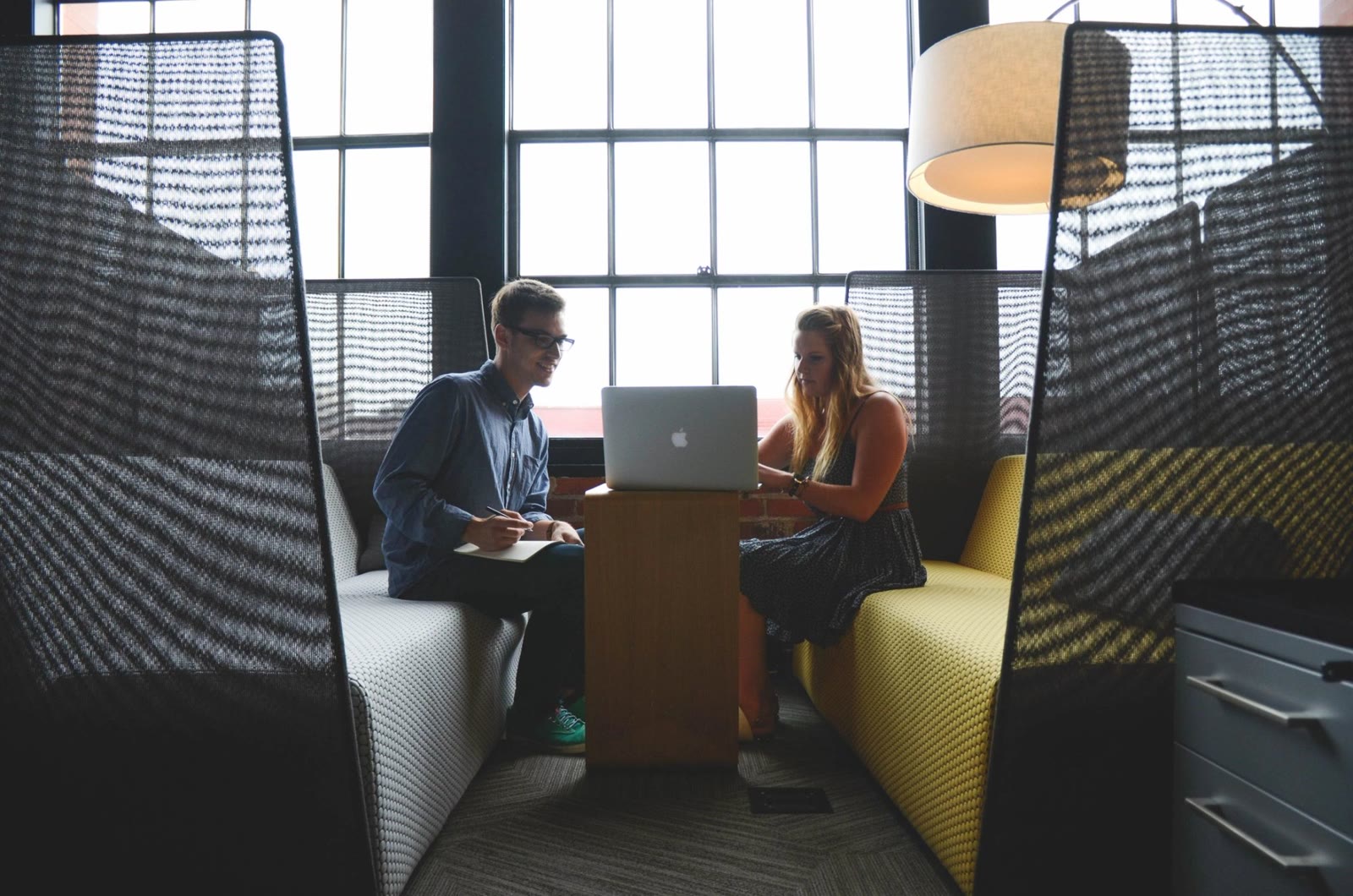 A debt specialist reviewing options with a client at a table